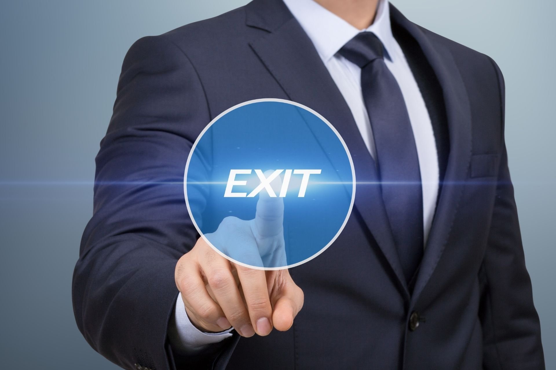 When to Exit FBA Business | Person pressing digital exit button
